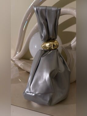 A Classy Chic Boutique Silver Mini Knot Bag with Gold Accent